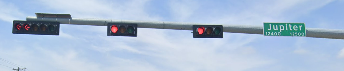 Traffic signal heads and a street sign for Jupiter Road.