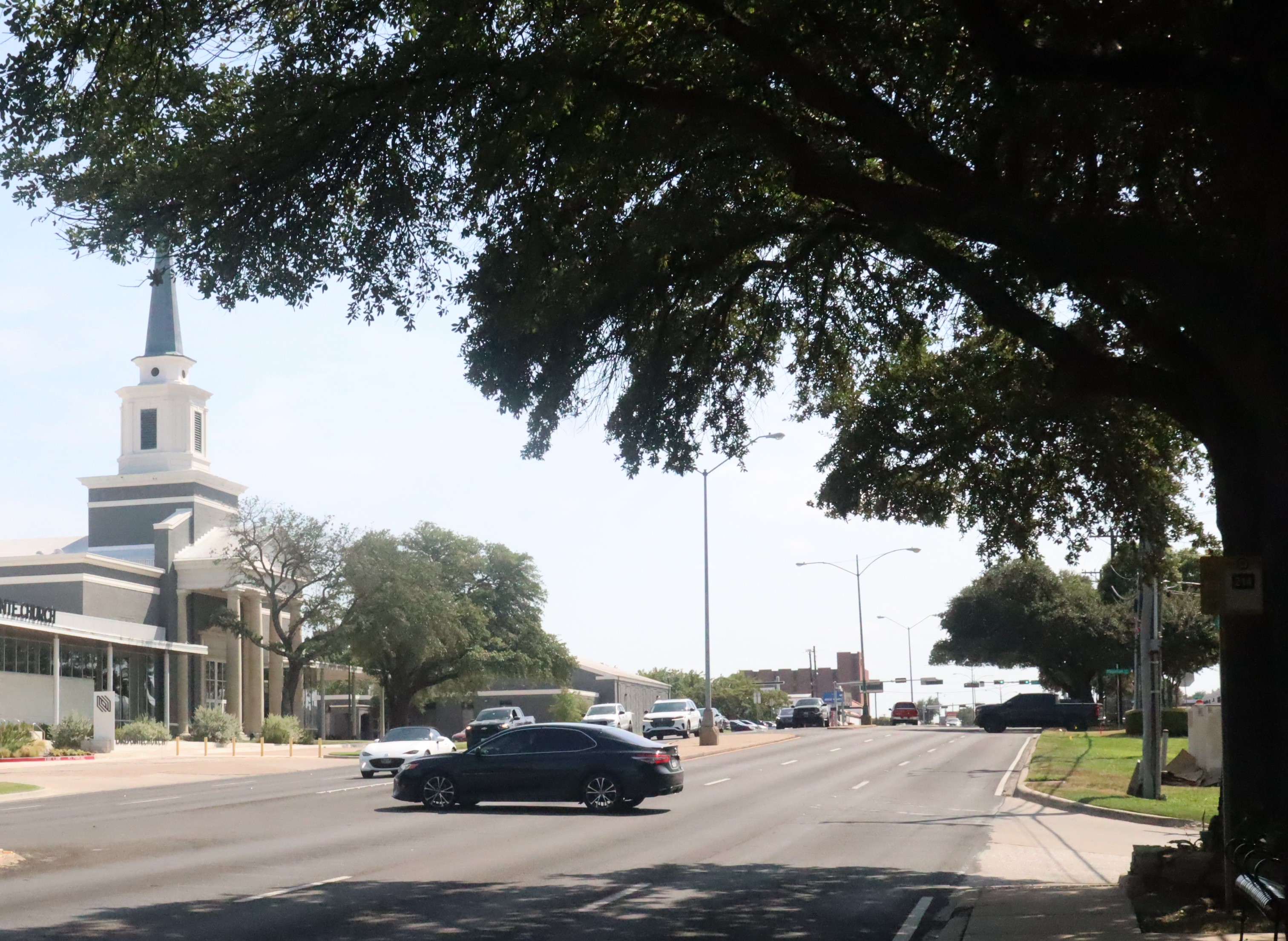 Vehicles traveling along Garland Road.